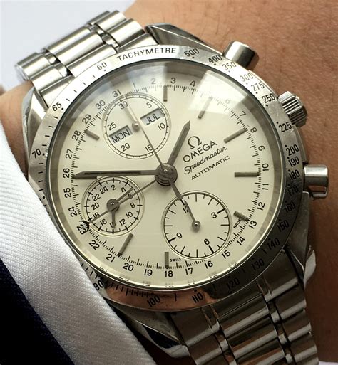 omega speedmaster automatic triple date.